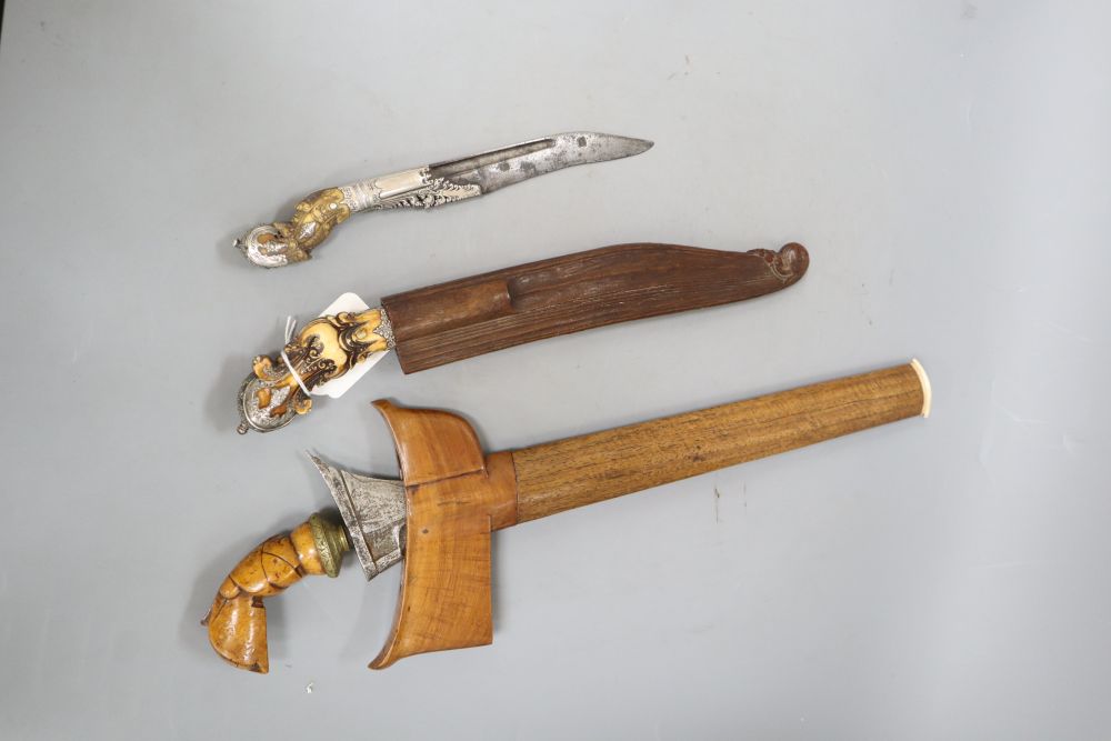 Two Ceylonese knives Pia Kaetta, both with ivory grips and silver mounts and a Malayan dagger kris (3)